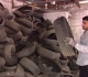 A young man from Gaza recycles damaged vehicle tires into friendly tools