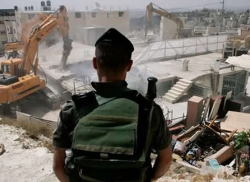 The occupation demolishes a commercial store in Jabal Mukaber