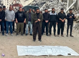 After two years under the rubble, a Palestinian man bids farewell to his wife and quadruplets in a single body bag in Gaza.
