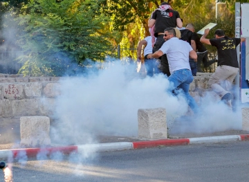 The occupation suppresses a stand of support for the people of Sheikh Jarrah and Silwan neighborhoods in occupied Jerusalem