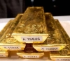 Gold rises as demand for dollar subsides
