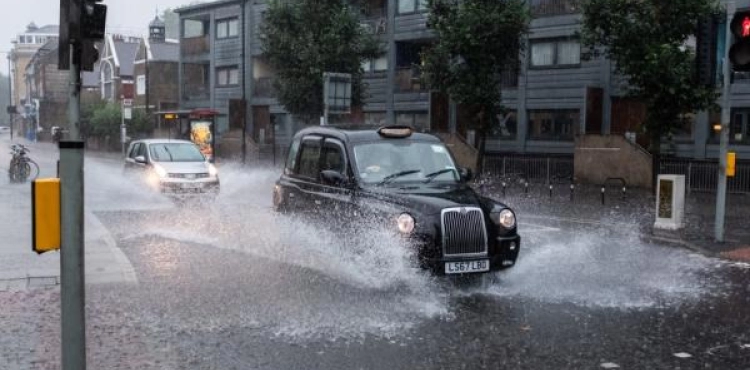 Water floods streets and underground stations in London due to thunderstorms