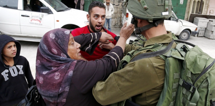 Israeli forces arrest a Palestinian woman from Ramallah