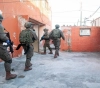 The occupation forces arrested 14 Palestinians from the West Bank