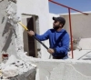 The occupation forces a Palestinian to demolish his home in Jabal Mukaber, Jerusalem