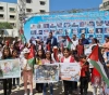 Gaza children launch balloons bearing pictures of martyrs and call for their protectionØ§
