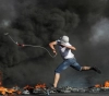 Dozens injured by metal bullets and suffocation in Kafr Qaddoum clashes