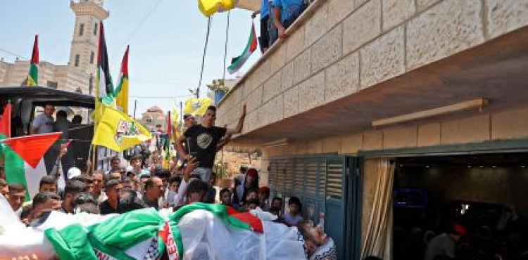 Large crowds attend the funeral of the martyr Mohamed Hassan in Qusra