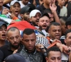 Thousands mourn the body of the martyr Imad Hashash in Balata refugee camp