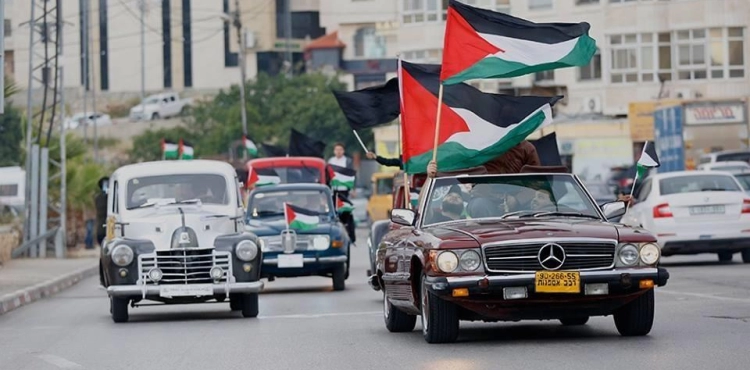 A march of old vehicles in Jenin embodying the right of return