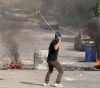 The arrest of a citizen in Kafr Qaddoum.. Two wounded by Israeli bullets in Ni&acute;lin
