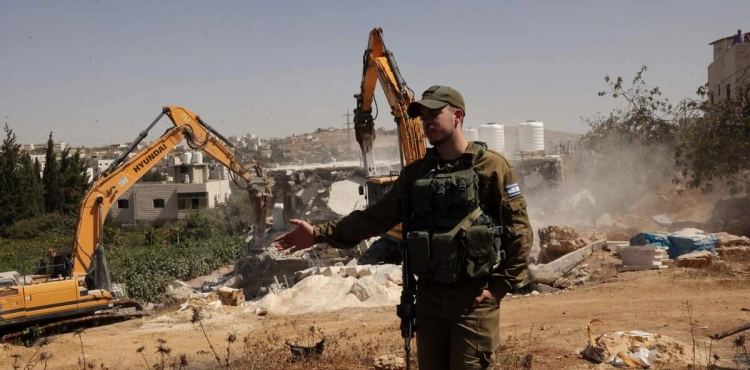 The occupation demolishes houses and bulldozes land in favor of a settlement street in Yatta