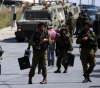 Israeli forces arrest 10 citizens in the West Bank and Gaza Strip