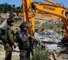 Occupation forces family to demolish two houses in Silwan