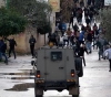A martyr and more than 20 wounded by settlers during a raid on the village of al-Mughair east of Ramallah