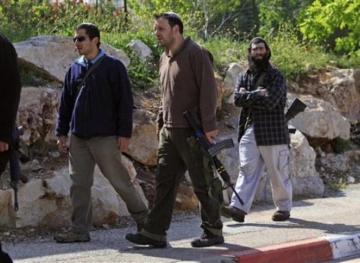 Settlers close the entrance to the eastern milk south of Nablus
