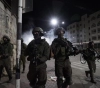 Israeli forces arrest 12 Palestinians from the West Bank