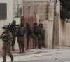 Israeli occupation forces arrest 14 citizens from Jerusalem and the West Bank