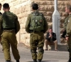 Israeli soldiers destroy a shop near the Tomb of the Patriarchs
