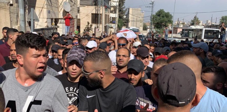Thousands of Palestinians take part in the funeral of martyr Mohammed Obeid in Issawiya