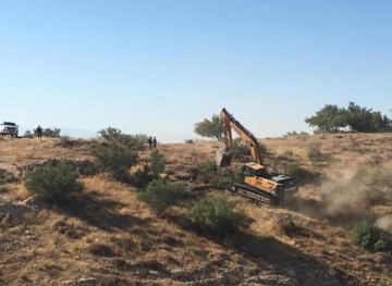 The occupation demolishes a park and uprooting trees in Umm al-Khair in Hebron