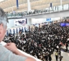 Thousands of protesters in Hong Kong sit in the airport