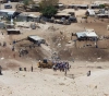 Protesters confront settlers who stormed the village of al-Khan al-Ahmar, threatened with demolition