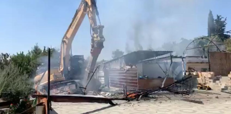 The Israeli occupation forces demolish a restaurant and a house in Beit Jala