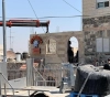 The Israeli municipality demolishes a house in Al-Tor