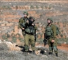 A young man from Kafr Qaddoum is arrested and a bulldozer and a truck are confiscated