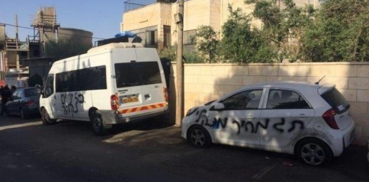 Settlers destroy vehicles and write racist slogans in Qira, north of Salfit