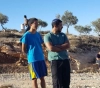 A settler assaulting farmers while harvesting olives east of Tulkarm
