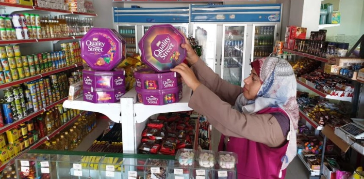 Girls break their handcuffs and work in marketing at a shopping mall in central Gaza City