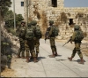 Israeli occupation arrests 15 Palestinians from the West Bank