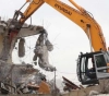 Israeli forces demolish a house in the industrial zone north of occupied Jerusalem