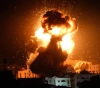 The occupation bombards targets in Gaza and damages a number of homes of citizens
