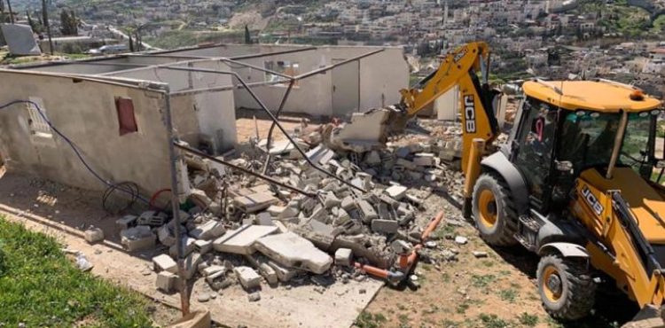 The occupation forces a family to self-demolish its home in Al-Mukabber