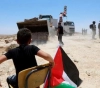 The occupation notifies a citizen of demolishing structures and uprooting trees in the northern Jordan Valley