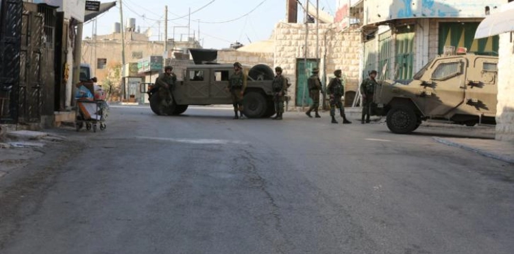 Settlers prevent the rehabilitation of the wall of a house in Tel Rumeida, in the center of Hebron