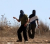 Residents, as they confronted dozens of settlers, tried to storm their village