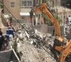 The occupation forces a Jerusalemite family in Shuafat camp to demolish their building
