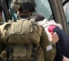 Israeli occupation army arrests citizens and assaults photojournalist