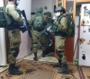 The occupation soldiers continue to arrest the Palestinians with muzzles