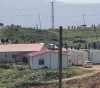 Settlers rebuild buildings in an outpost near Nablus
