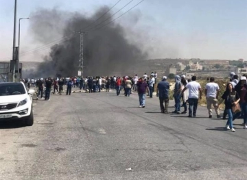 Clashes with Israeli occupation forces at &quot;Beit El&quot; Checkpoint