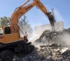 Video Israeli bulldozers demolish two apartments and 4 commercial warehouses in Shuafat camp