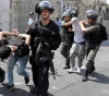 A citizen of Qalqilya was wounded and 14 others were arrested in the West Bank governorates