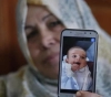 An infant from Gaza ... a victim of a stop to security coordination