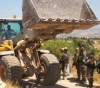 The occupation forces arrest a citizen of Al-Jiftlik and confiscate his bulldozer
