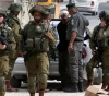 Occupation arrests 13 citizens in the West Bank